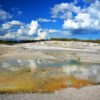 Reflections Over Colorful Runoff Pan Of Constant Geyser In Yellowstone National Park, Wyoming