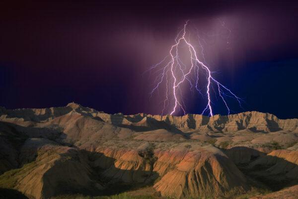 Colorful Lightning Strikes The Formations In Badlands National Park, South Dakota