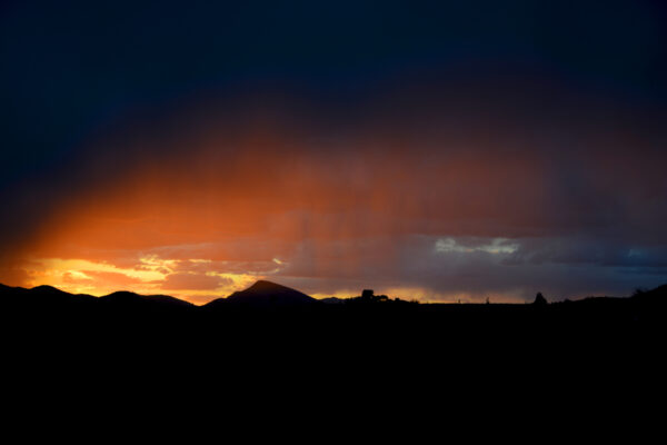 Curtains Of Delicate Rainfall Capture Deep Orange Hues As Sunset Falls Over The Heat Of The Sonoran Desert, Arizona