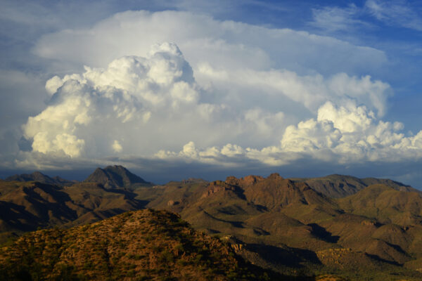 The Very Tall Peaks Appear Small Under The Tens Of Thousands Of Feet Tall Monsoon Clouds Hovering Over The Mazatzal Mountains In Arizona