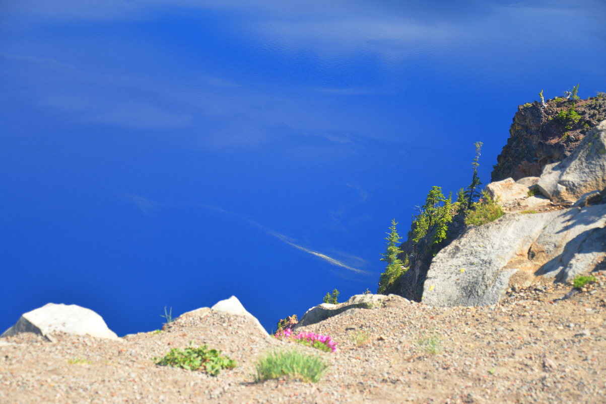 is-that-the-blue-sky-streaked-with-clouds-below-the-rocks-and-trees-or